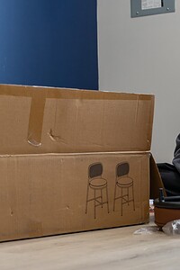 Professional furniture assembly by John Langevin, skilled interior design expert at work.