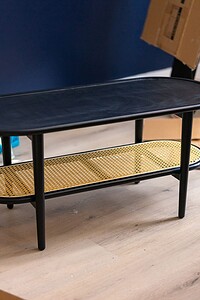 Stylish black and yellow side table with modern design, perfect for contemporary home decor.