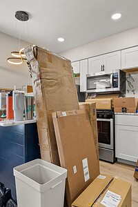 Kitchen moving boxes and unpacking supplies for residential renovation projects.