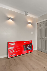 Bright and contemporary home interior featuring storage solutions and stylish lighting, designed by John Langevin for modern living.