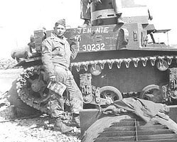 Cpl. Bob Bronge and Pvt. John Massimino work on their tank. Bronge-Massimino