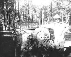 Haorld Lane, Jim Edwards, and Al Edwards on the maneuvers with jeep. Soldiers