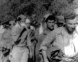 In this photo is Cpl. Al Brown with handkerchief against his face. March 8