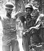 Japanese soldier searching POWs for plunder. Mariveles 10