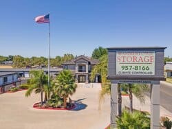 A high-quality image of the front of Hammertown Self Storage in Stockton, CA. The facility's entrance is clean and well-maintained, featuring a prominently displayed sign with the business name and logo.