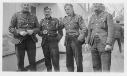 L to right: Capt Mike Turnbull; Maj Maybin; Lt G Malone and unidentified. Canada 1919 onboard RMS Baltic.