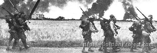 In this captured photo, Japanese soldiers advance on the Island of Luzon.
U. S. National Archives Japanese soldiers advance