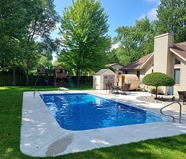 Vinyl Lined In-Ground Pool with Fiberglass Corner Step and Diving Board