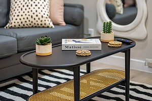 Stylish living room with cozy sofa, decorative pillows, and modern accents.