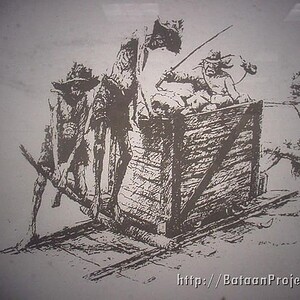 On a work detail most likely to build a runway at an airfield, the undernourished POWs attempt to move a car full of rocks.
Courtesy of Ben Steele © Work Detail