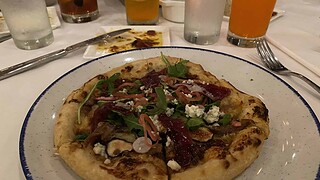 Handmade pizza at California Grill at the Contemporary Resort. Duck Pizza
