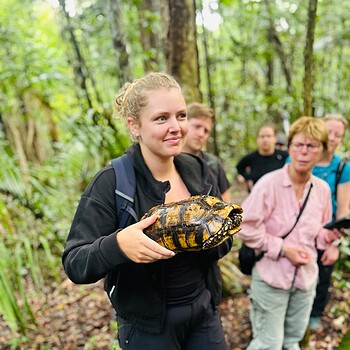 Girl holding turtle