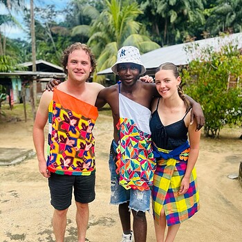 Photo three people traditional clothing outdoors 2026 05