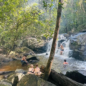 Waterfall forest swimming people 2026 05