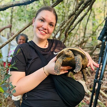 Woman holding tortoise 2026 05