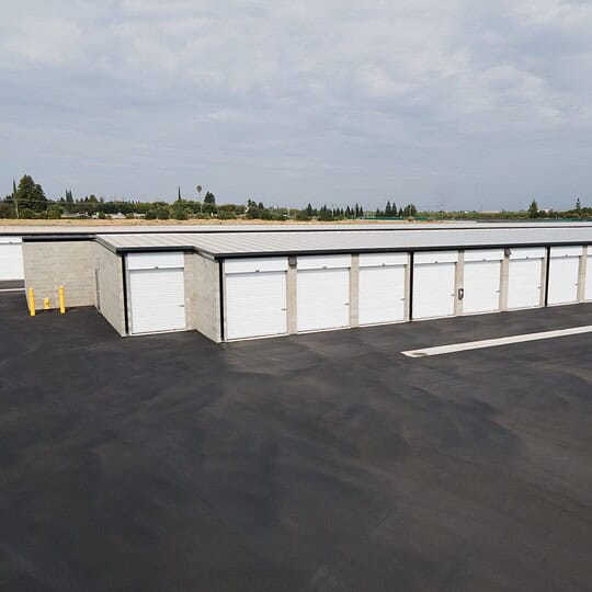 Row of our clean and secure storage units in Modesto, California, featuring easy drive-up access.