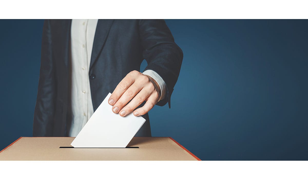 Man Voiter Putting Ballot Into Voting Box. Democracy Freedom Concept