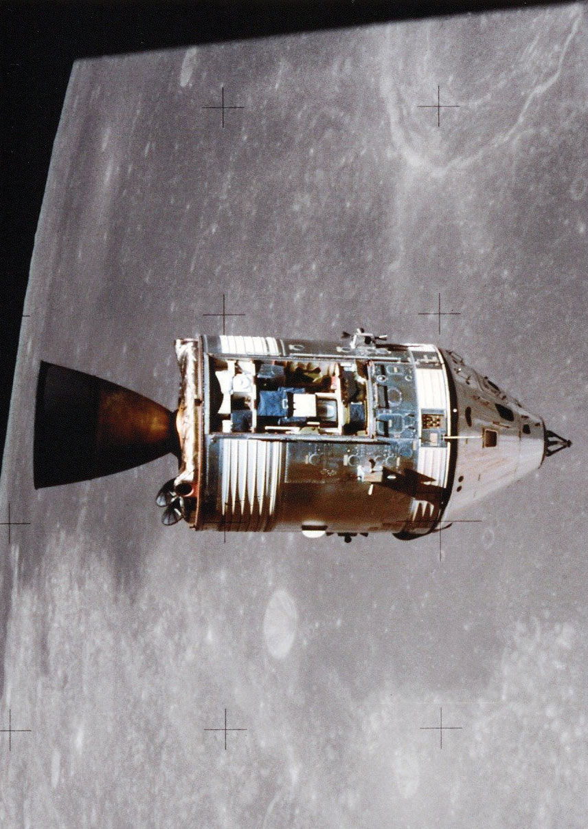 As photographed from the lunar module, the Apollo 15 command and service modules are in lunar orbit with the moon's surface in the background. Worden piloted the command module while Scott and Irwin were on the moon's surface. The three days he spent alone earned him a place in the "Guinness Book of World Records" as the "most isolated human being."