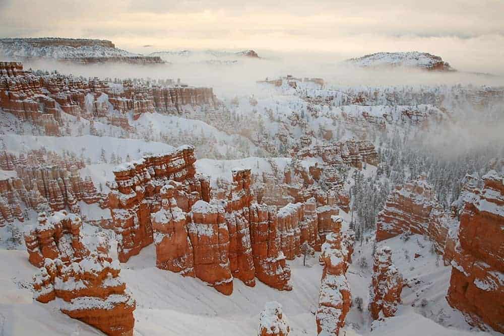 Snow and fog cover the hoodoos at Bryce Canyon main amphitheater. Photo: Bryce Canyon NPS, public domain.