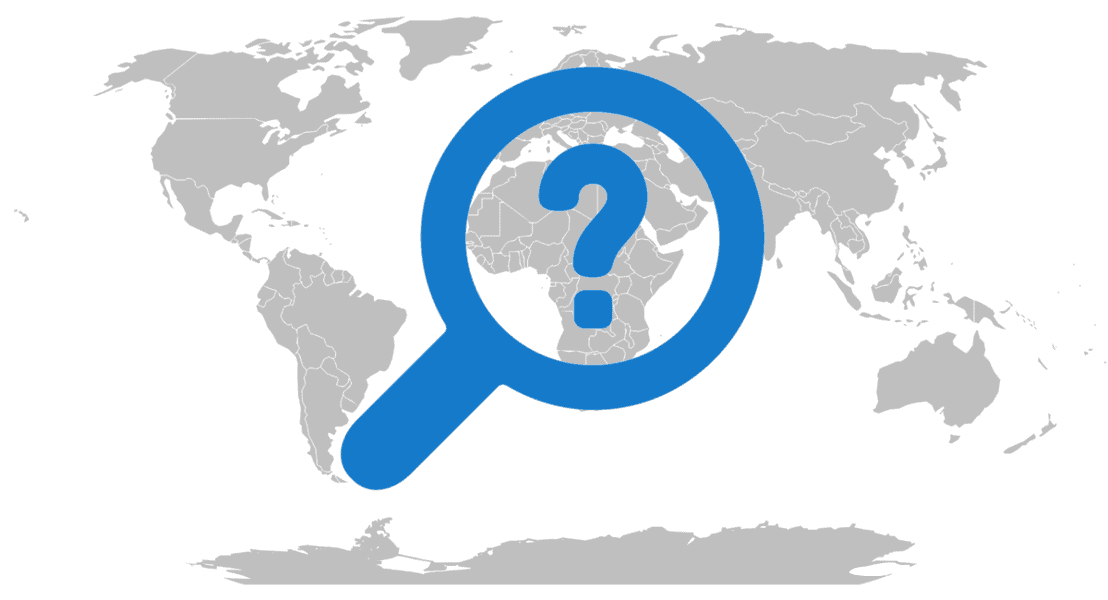 Grayscale map of the world with a question mark inside of a magnifying glass.
