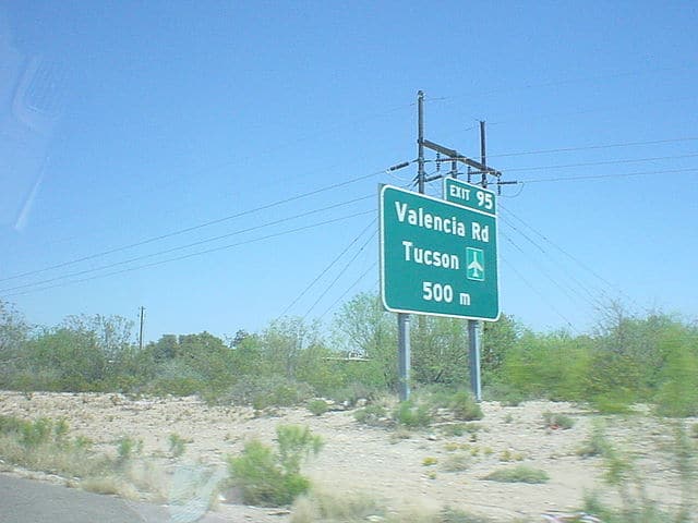 A road sign on Interstate 19 just south of Tucson taken April 18, 2005. Photo: NicAgent, Wikimedia.