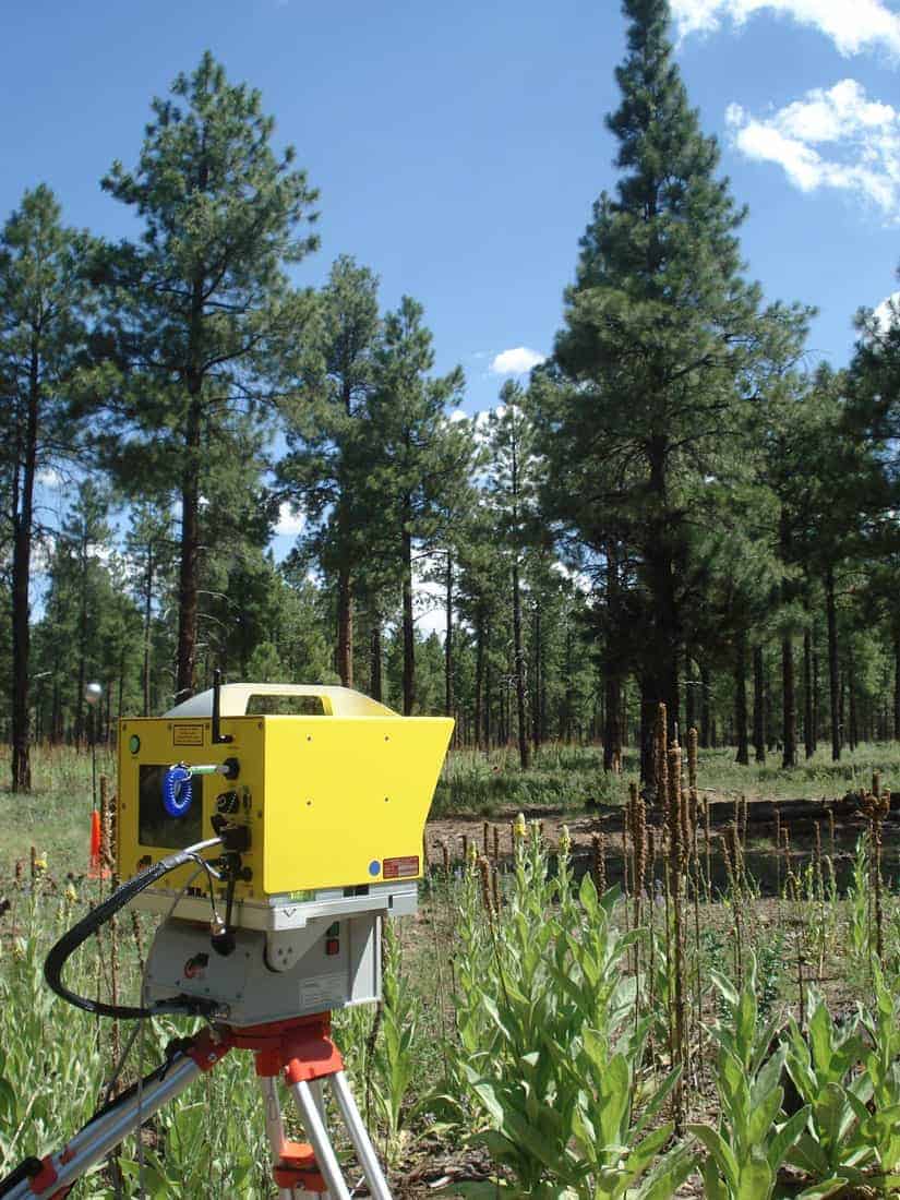A LiDAR (Light Detection and Ranging) instrument measures the 3-D structure of a ponderosa pine forest stand in Coconino National Forest near Flagstaff, Arizona, on July 13, 2009. Photo: Dennis G. Dye, U.S. Geological Survey. Public domain.