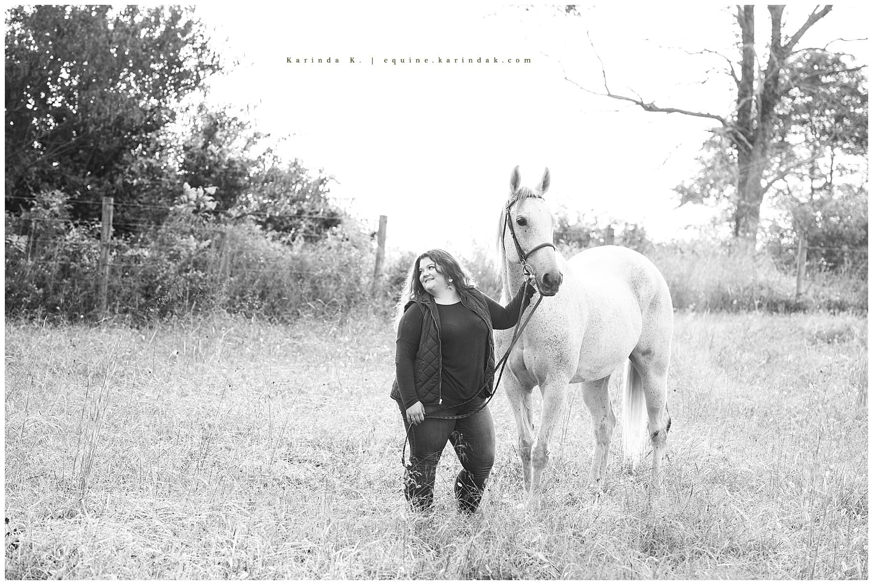 black and white horse and rider outdoor portrait
