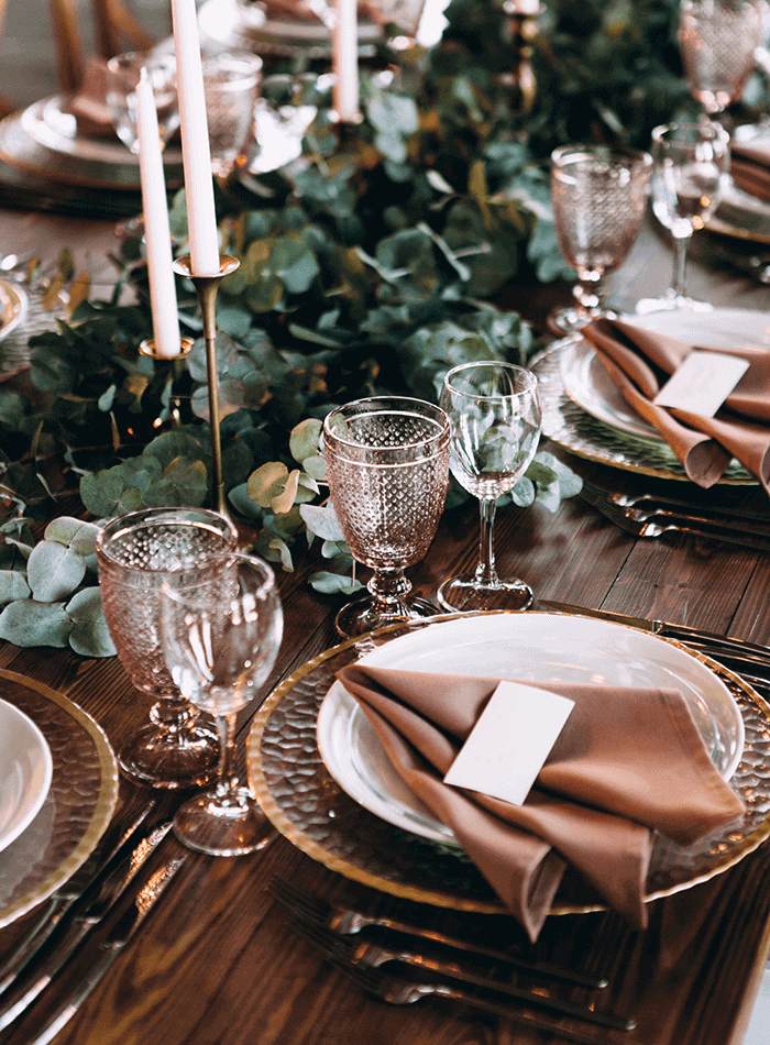 Beautiful table setting with glassware and candles in Thailand.