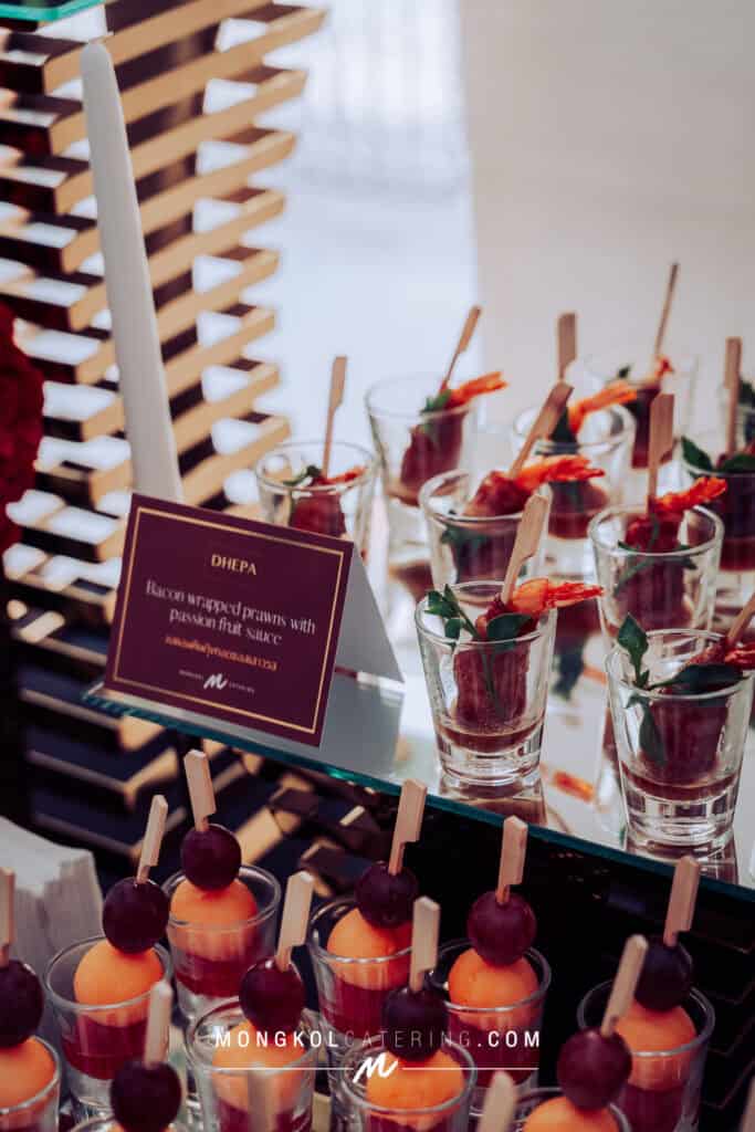 Elegant shrimp and bacon appetizer display at Mongkol Catering event in Thailand.