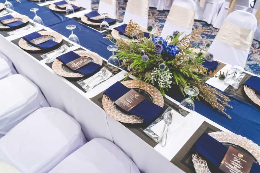 Elegant wedding table setup with floral centerpiece in Thailand, perfect for special events.