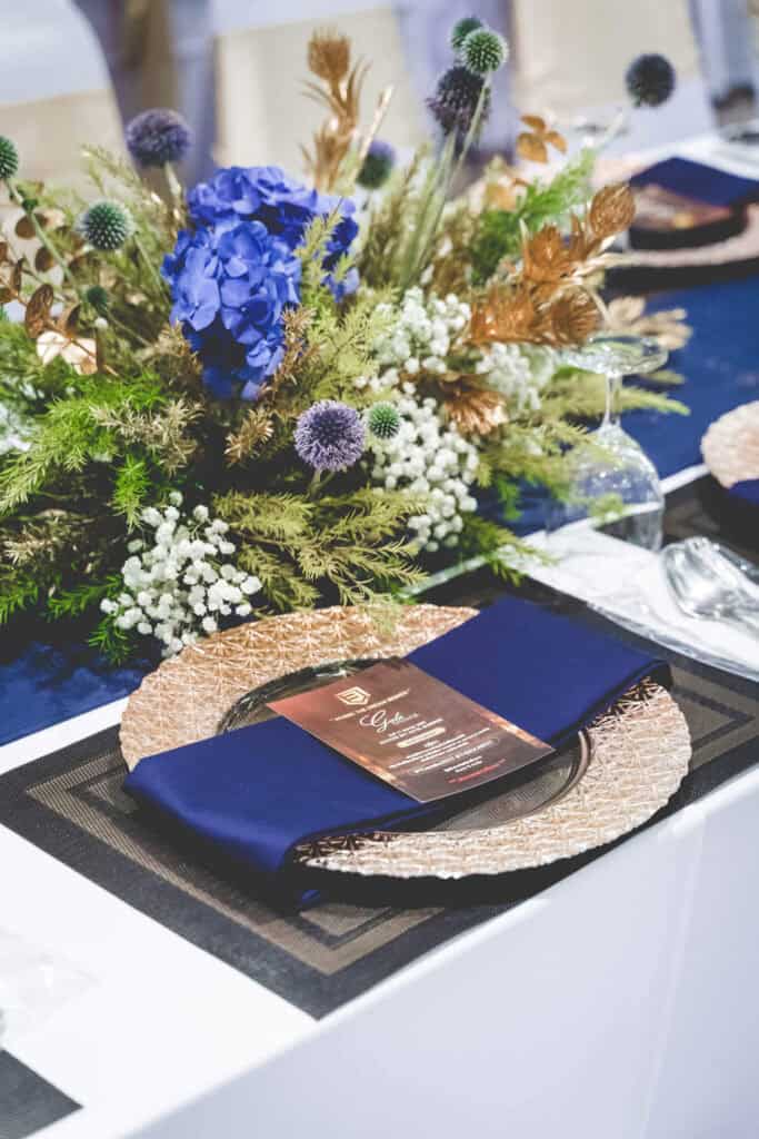Elegant event table setup with floral centerpiece in Thailand.
