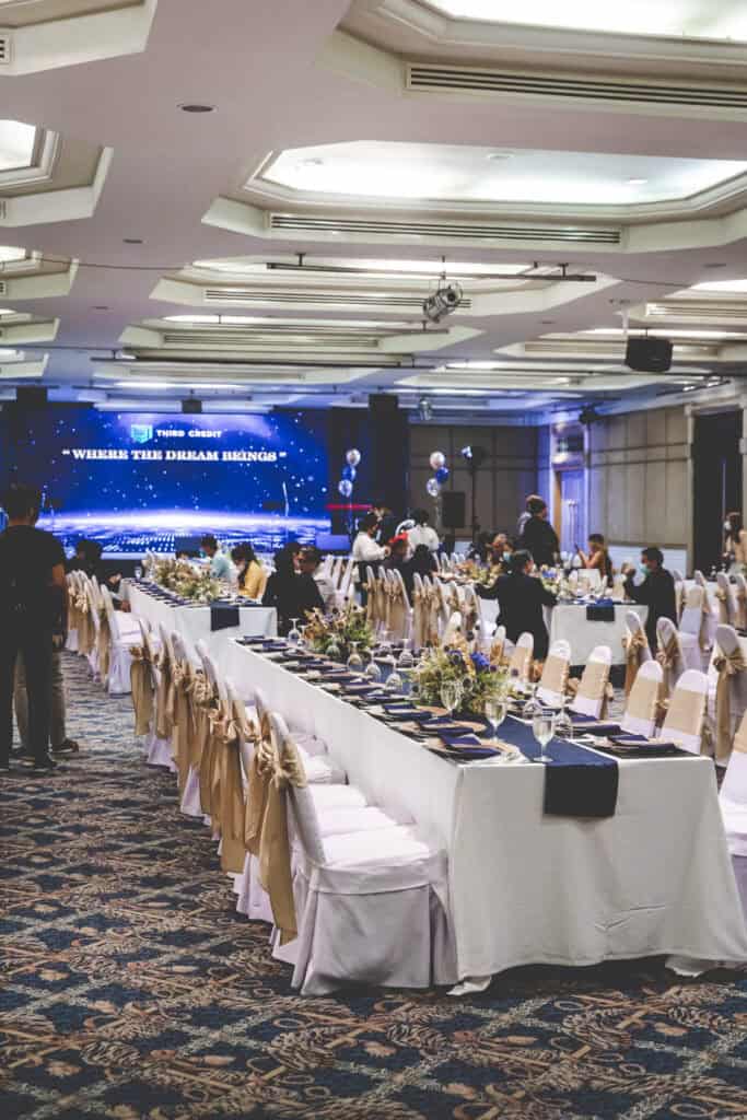 Luxurious banquet hall with elegant table setup for events in Thailand.