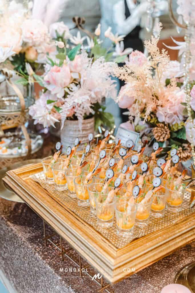 Elegant shrimp appetizers served at a floral decorated event in Thailand.