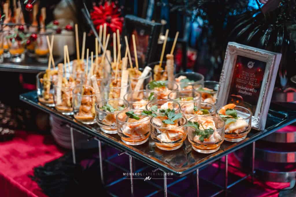 Delicious Thai appetizer platter with shrimp, skewers, and garnishes for special event catering in Thailand.