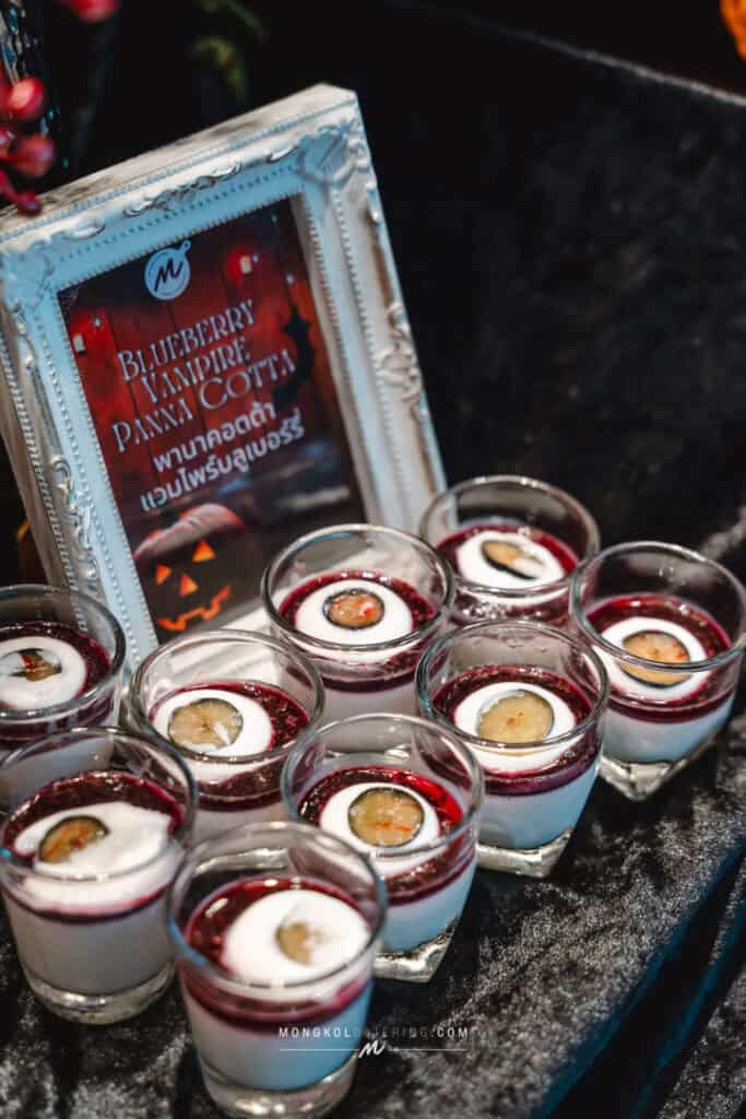 Blueberry Vanilla Panna Cotta dessert served at a Thai event, presented in small glass cups.