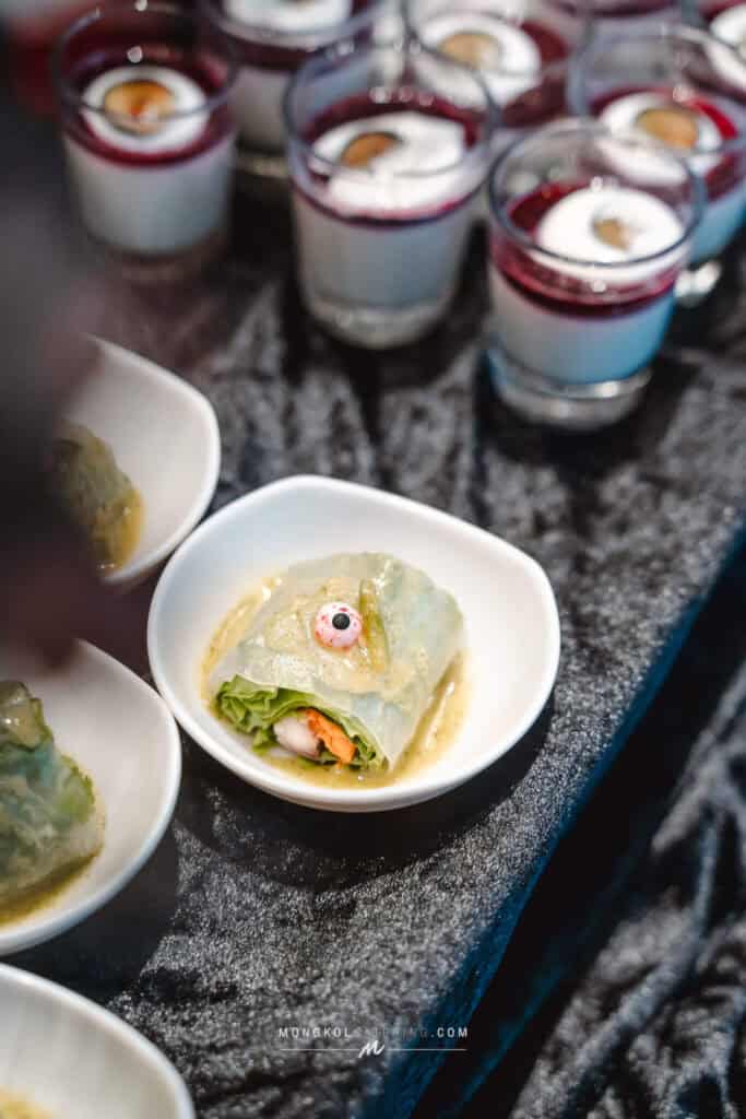 Chilled Thai spring rolls served with dipping sauce at an event in Thailand.