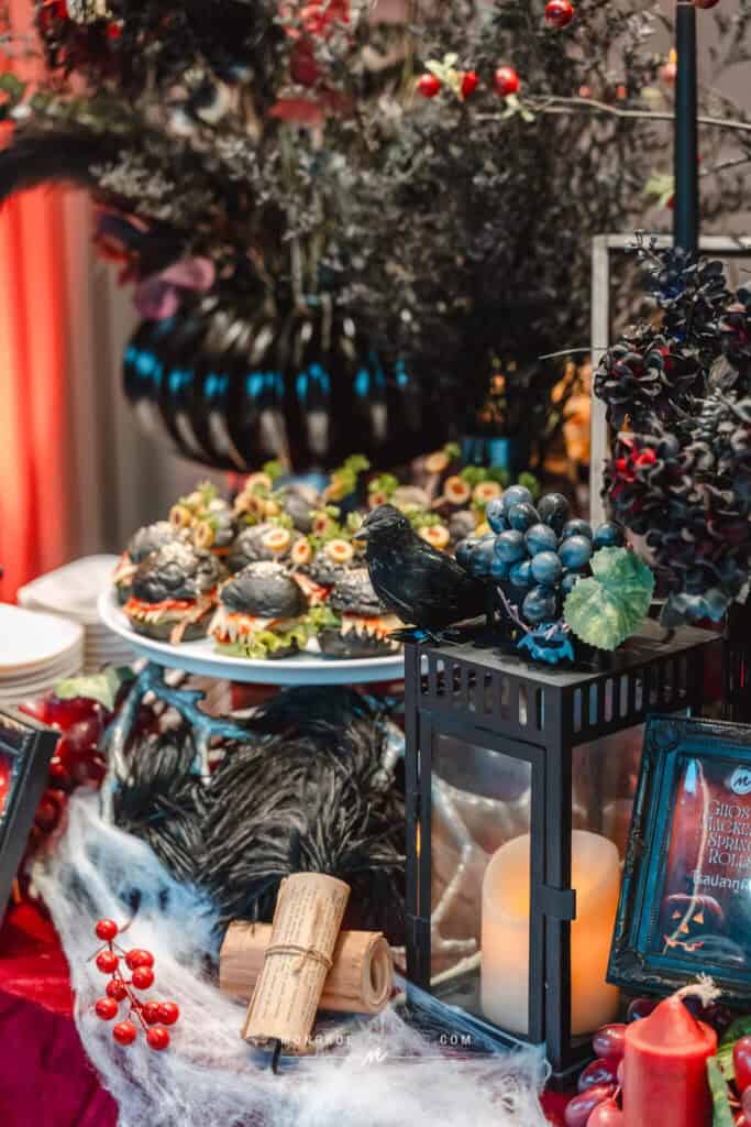 Colorful Halloween-themed event setup with spooky decorations and treats in Thailand.