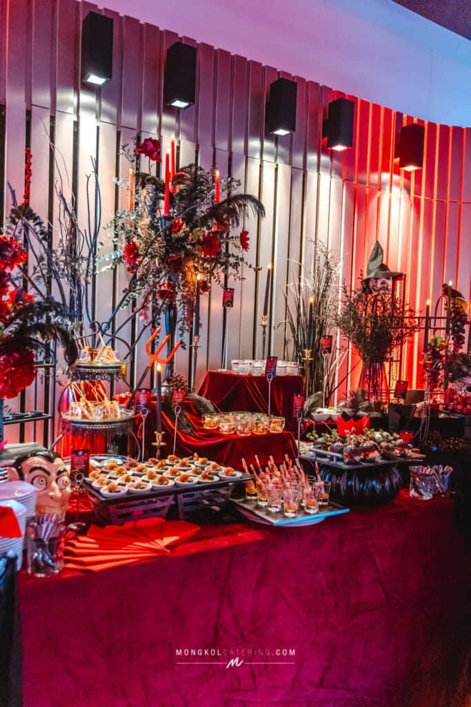 Colorful Halloween-themed event table setup in Thailand by Mongkol Catering.
