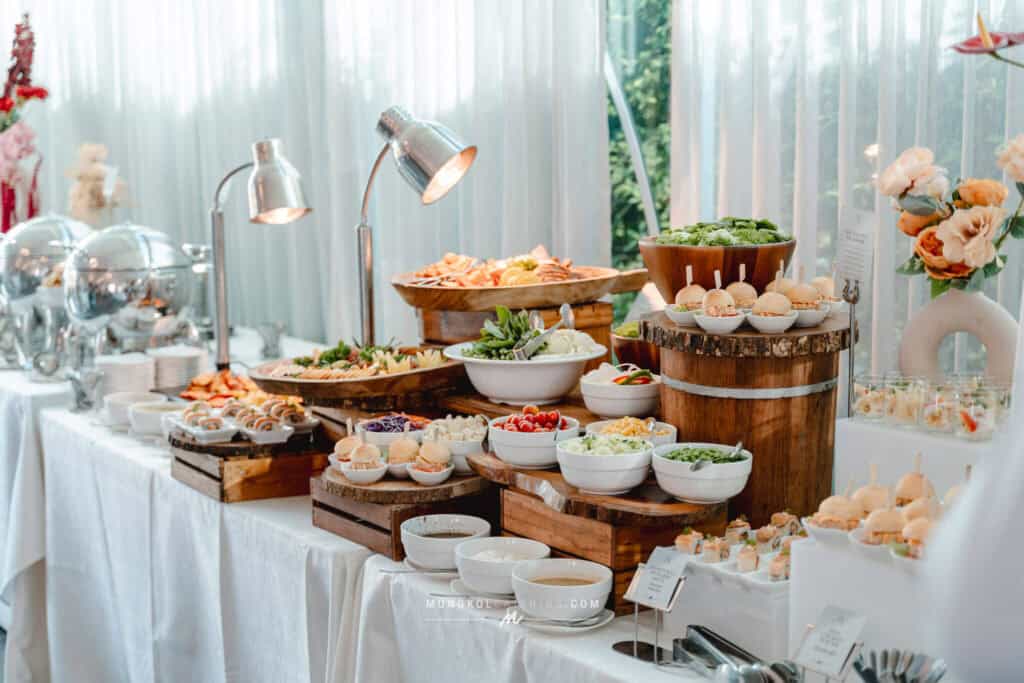 Elegant Thai catering buffet with fresh salads, desserts, and appetizers at Mongkol Catering, Thailand.