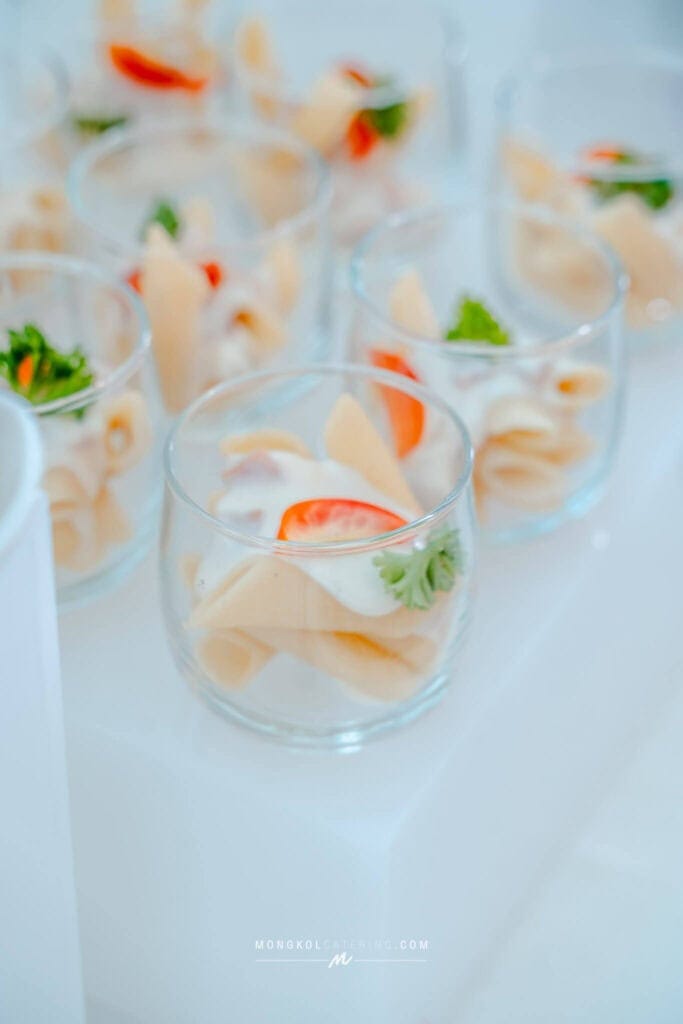 Fresh Thai appetizers served in elegant glassware at Mongkol Catering event in Thailand.