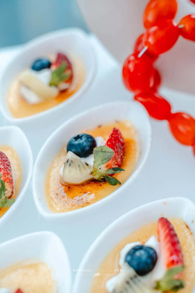 1. Assorted Thai dessert cups with fresh berries and fruit garnishes.