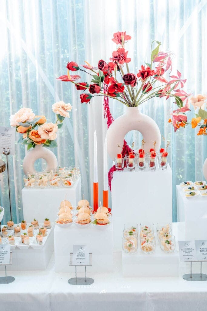 Vibrant floral arrangement with pink and red flowers for elegant event decor in Thailand.
