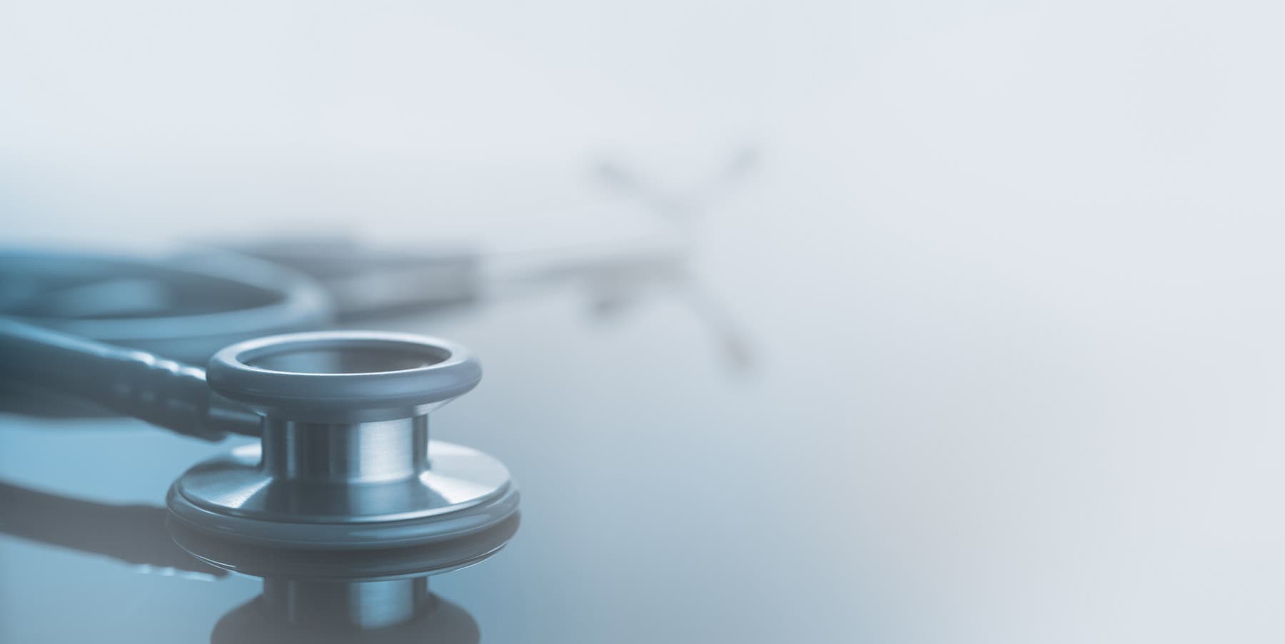 A stethoscope resting on a reflective surface, symbolizing mobile healthcare and medical outreach for individuals experiencing homelessness in Tampa Bay.