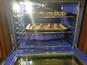 In conventional ovens, cookies cook differently on each rack.