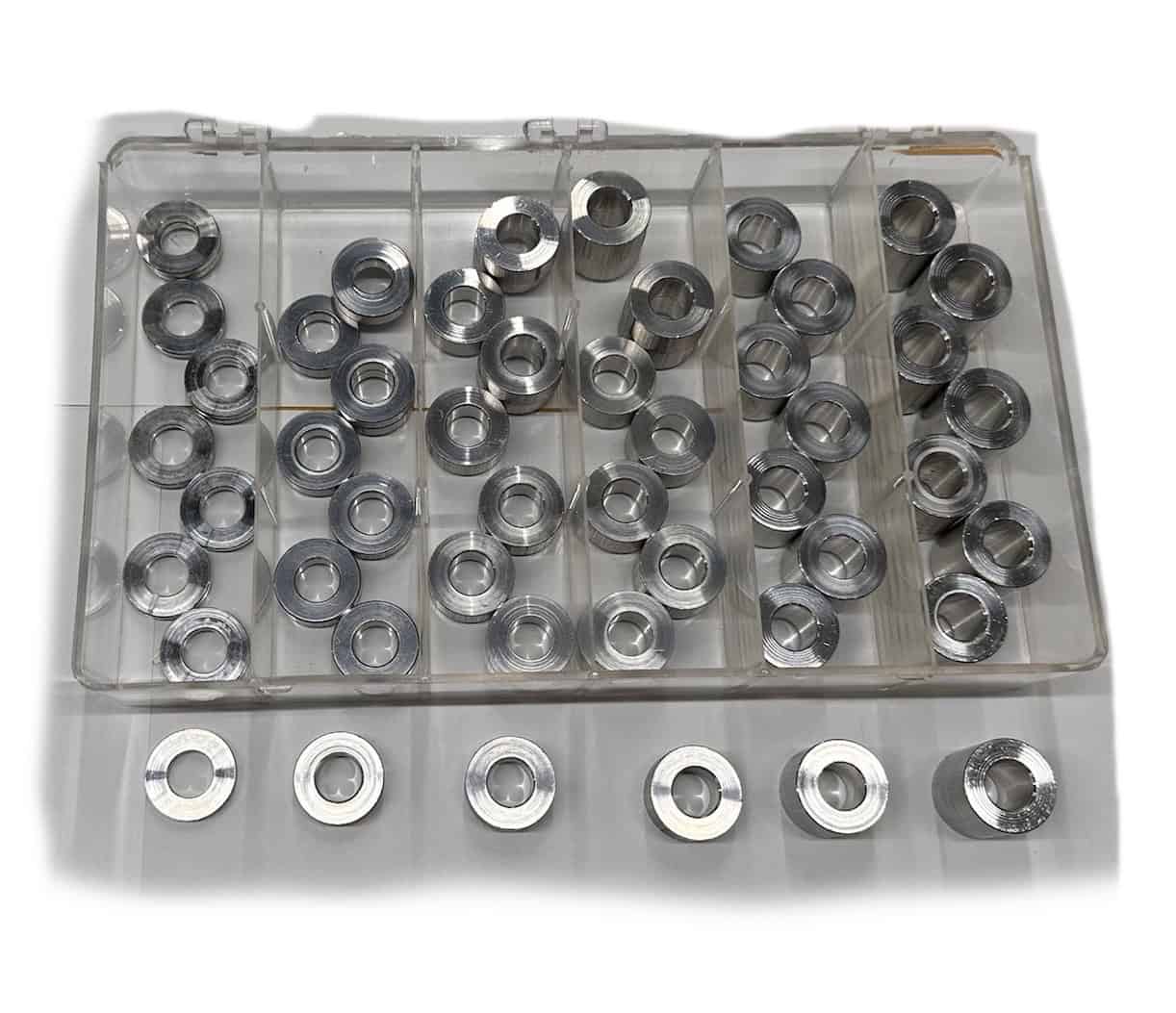 Stainless steel washers with threading for machinery and equipment assembly.