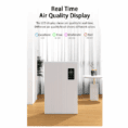 The Aerovex Systems Dual Core Wall Mount Air Purifier, in white, features a digital display showing real-time air quality with a color-coded key for Excellent, Fine, Moderate, and Bad air in a modern room with sheer curtains and a round side table. Read more at Aerovex Systems (aerovexsystems.com)