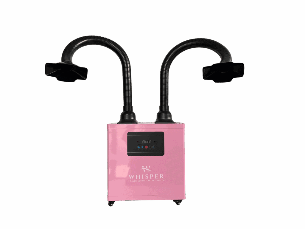A pink "Whisper" MiniVent Nail Salon source capture system features two black flexible hoses for dual station use, each ending in a square funnel. The front panel has control buttons, a digital screen, and the device sits on small wheels. Read more at Aerovex Systems (aerovexsystems.com)