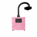 A pink box-shaped air filter machine labeled "WHISPER" serves as a single station source capture system, ideal for nail salon use. It has a digital display, front buttons, and a flexible black hose with a wide nozzle. The background is plain white. Read more at Aerovex Systems (aerovexsystems.com)