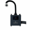 A black, box-shaped machine labeled "Whisper Smoke Extraction System" has a digital display and control buttons on its front. A flexible black hose extends upward with a lighted, circular nozzle at the end, while another hose exits from the side. Read more at Aerovex Systems (aerovexsystems.com)