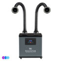 A gray "Whisper" salon source capture system with two flexible black hoses extending upward from the top, each ending in a round LED nozzle. The front panel displays digital controls and buttons. The unit sits on four wheels. Read more at Aerovex Systems (aerovexsystems.com)